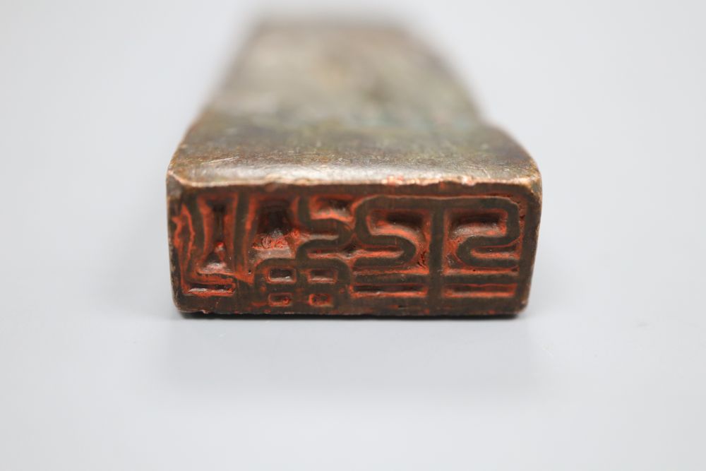 A Chinese bronze seal depicting a mountainous landscape